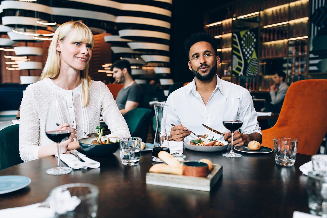 Pullman Berlin Schweizerhof Hotel Ngoại thất bức ảnh John Legend and his wife Chrissy Teigen at their restaurant, L.A. LIVE